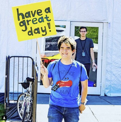 Me holding a picket sign wishing people to have a great day!